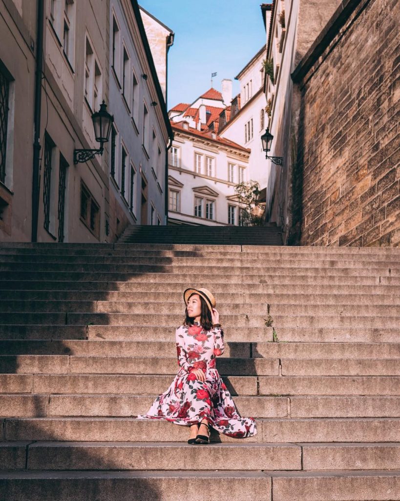 girl on cobblestone steps near Ke Hradu Road in prague