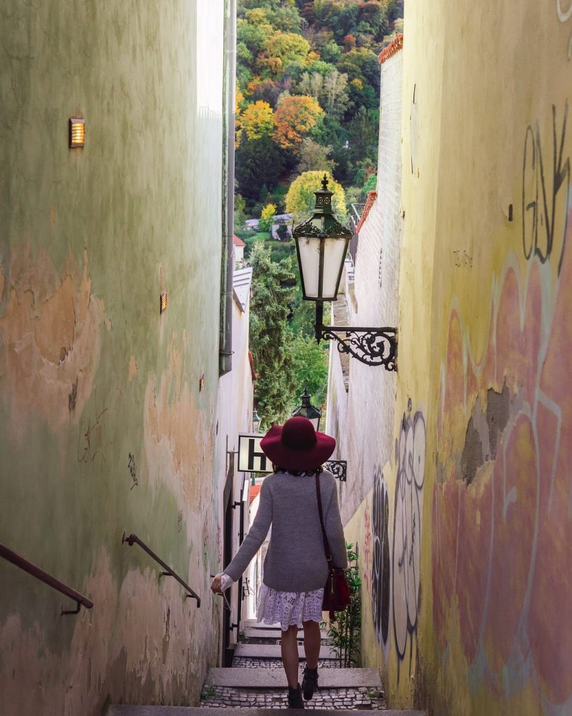 picture of girl in the narrowest street in Prague