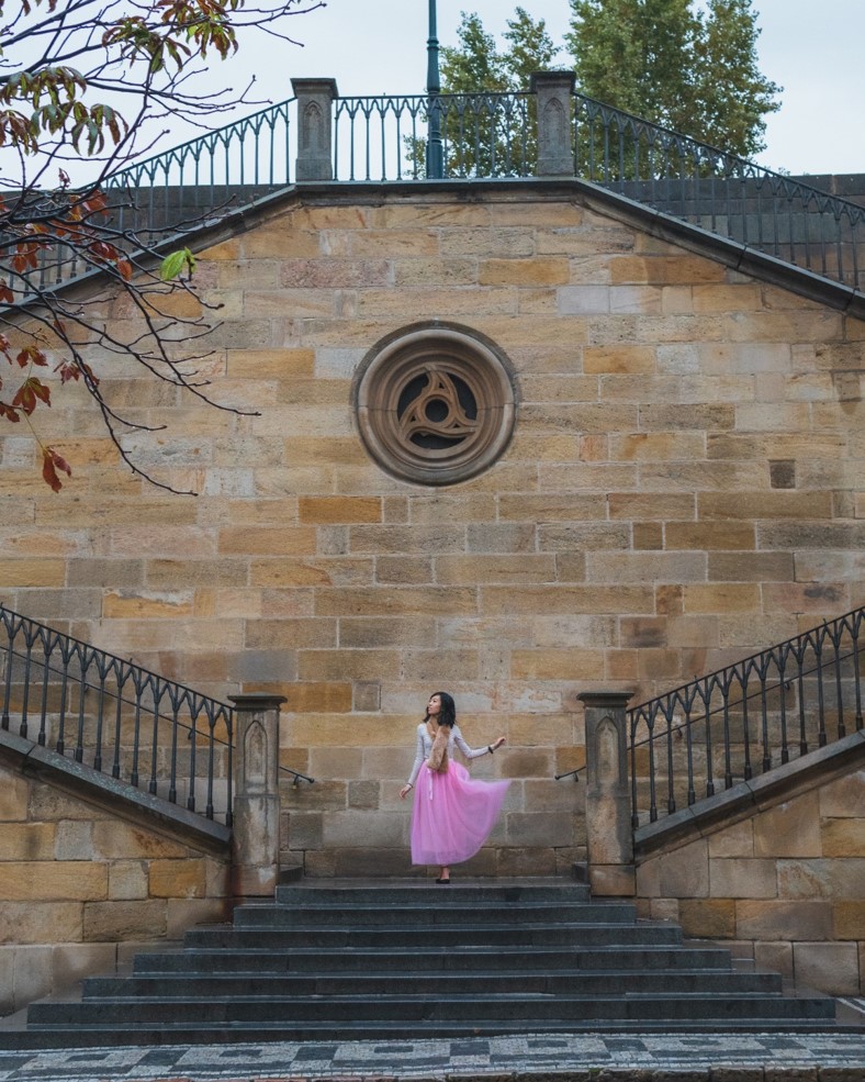 girl on stairs near kampa island in prague