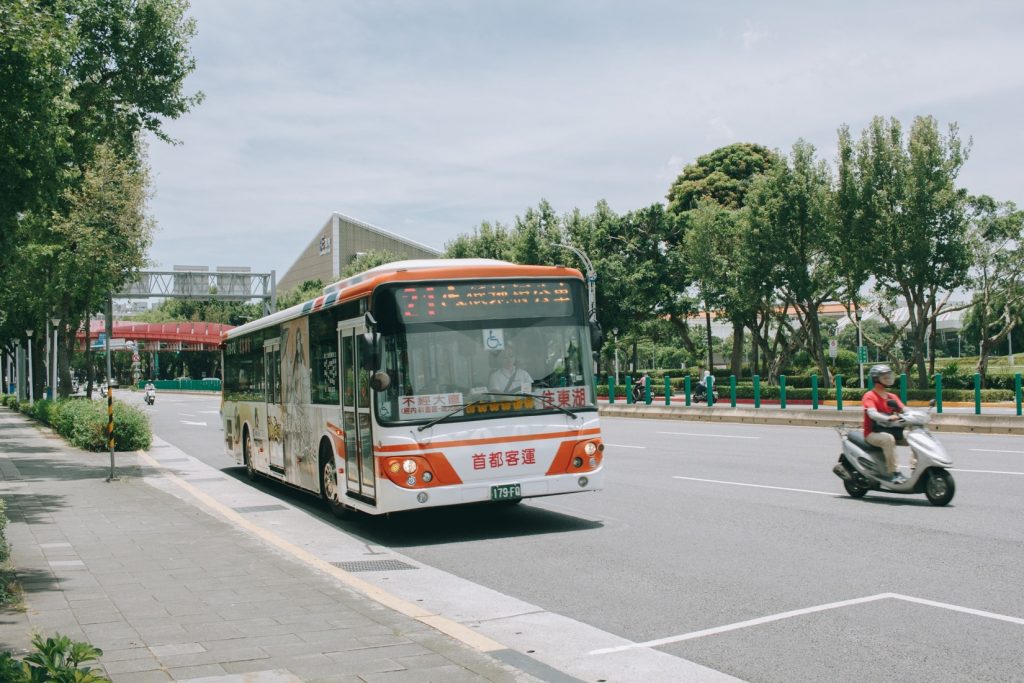 Bus driving along the road in Taipei - witandfolly.co