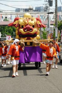 people participating in tsukiji lion dance festival