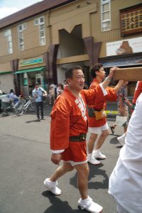 people participating in tsukiji lion dance festival