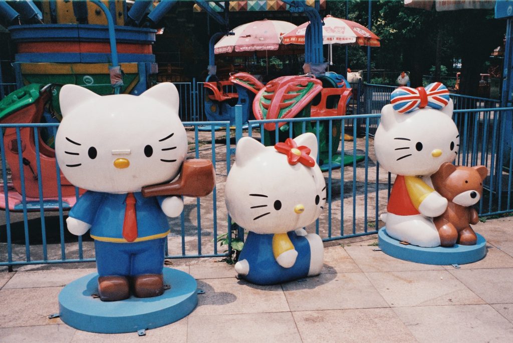 three hello kitty statues