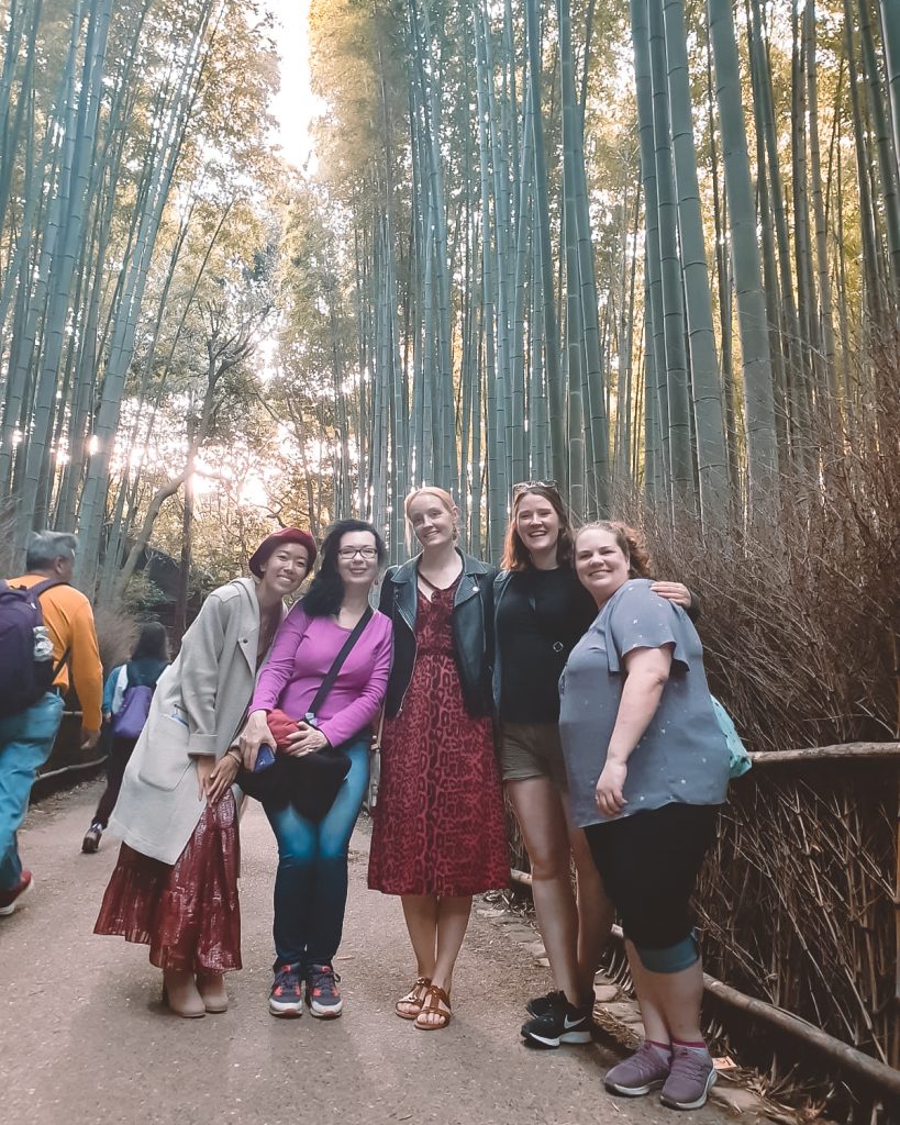 women smiling in bamboo grove