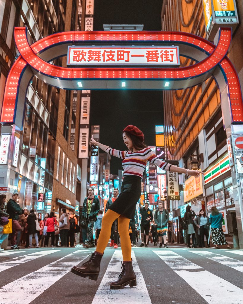 girl in Shinjuku cross walk red sign