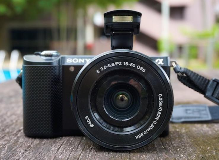 photo of a black camera on a table