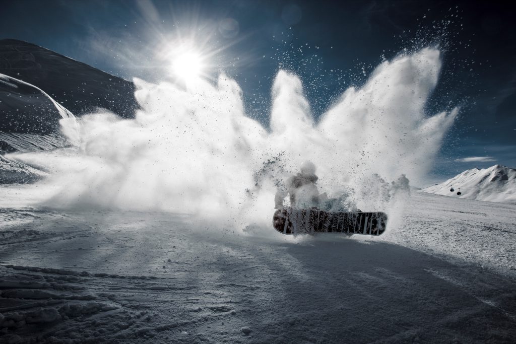 person stopping on a snowboard