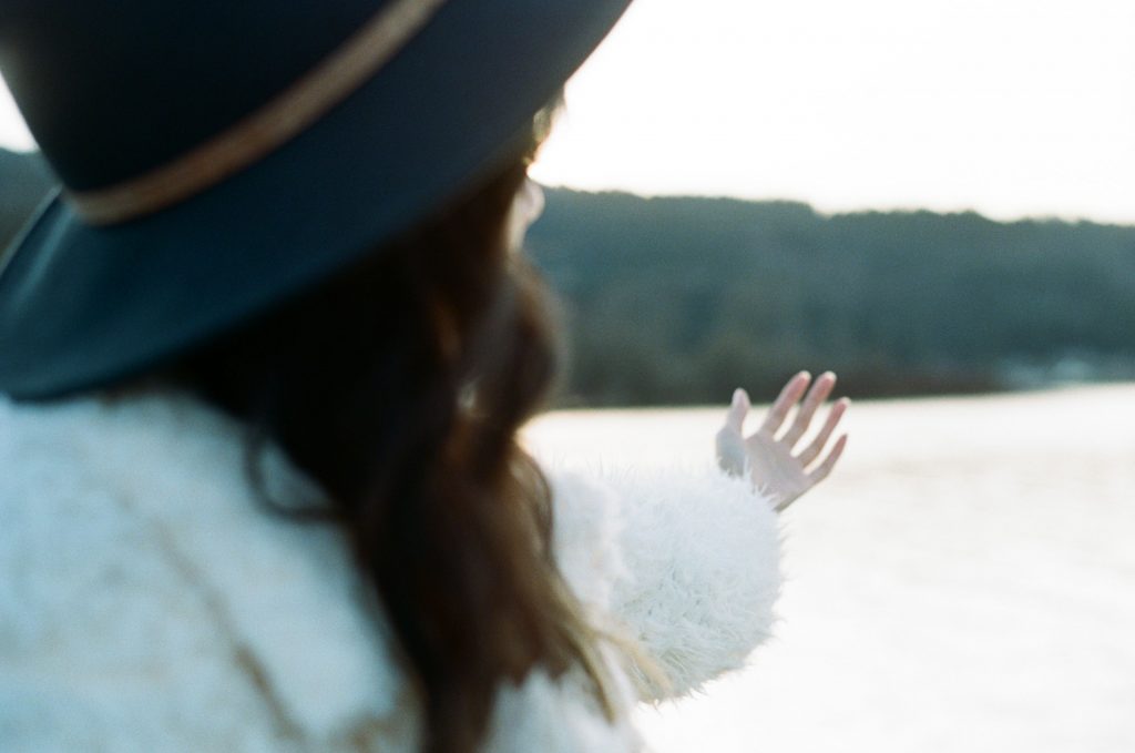 image of girl in front of lake