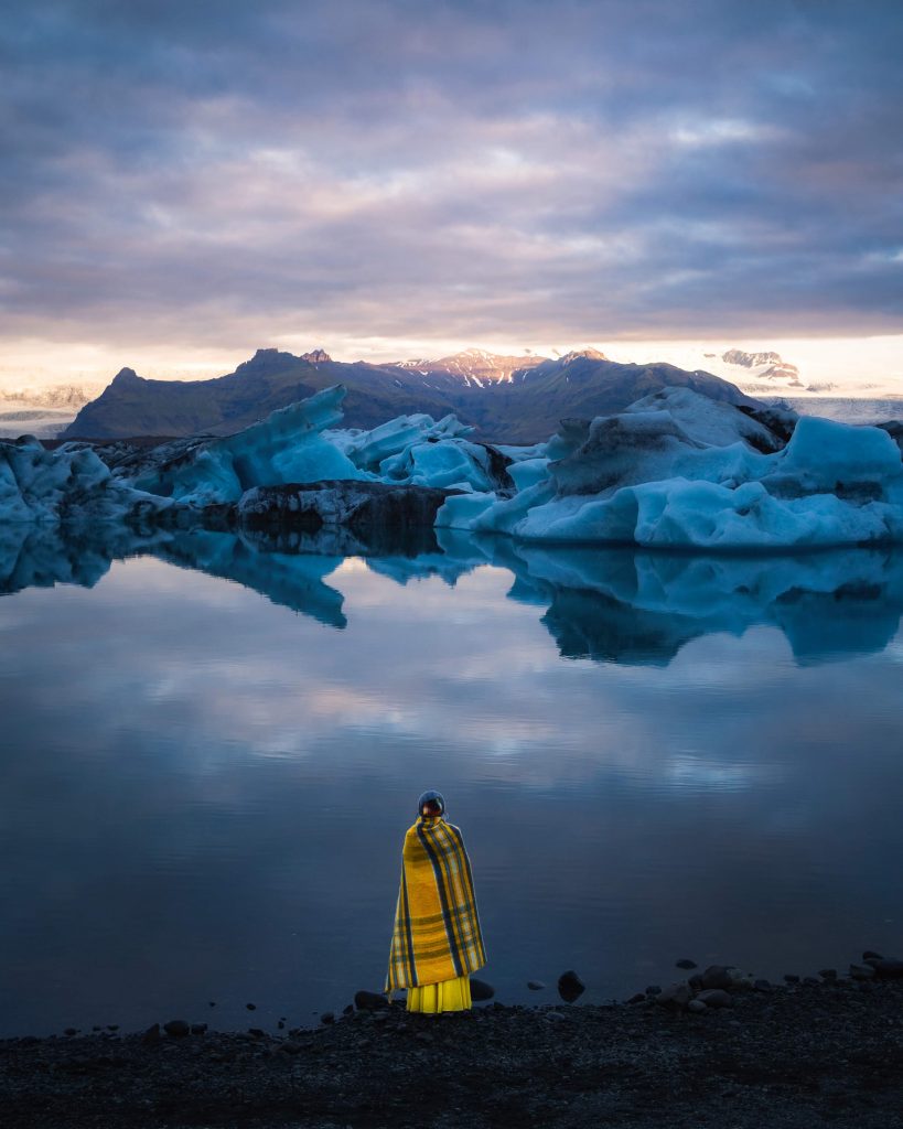 image of a girl in front of the glacier lagoon in iceland