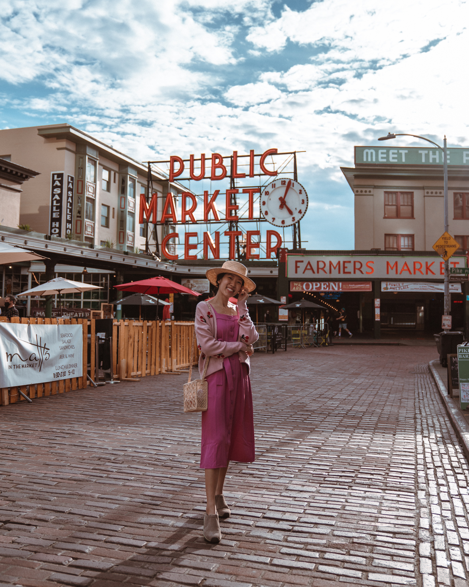 Girl in front of Pike Place Market sign in Seattle