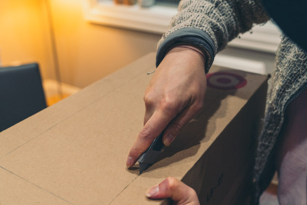 image of measuring a window on card board box