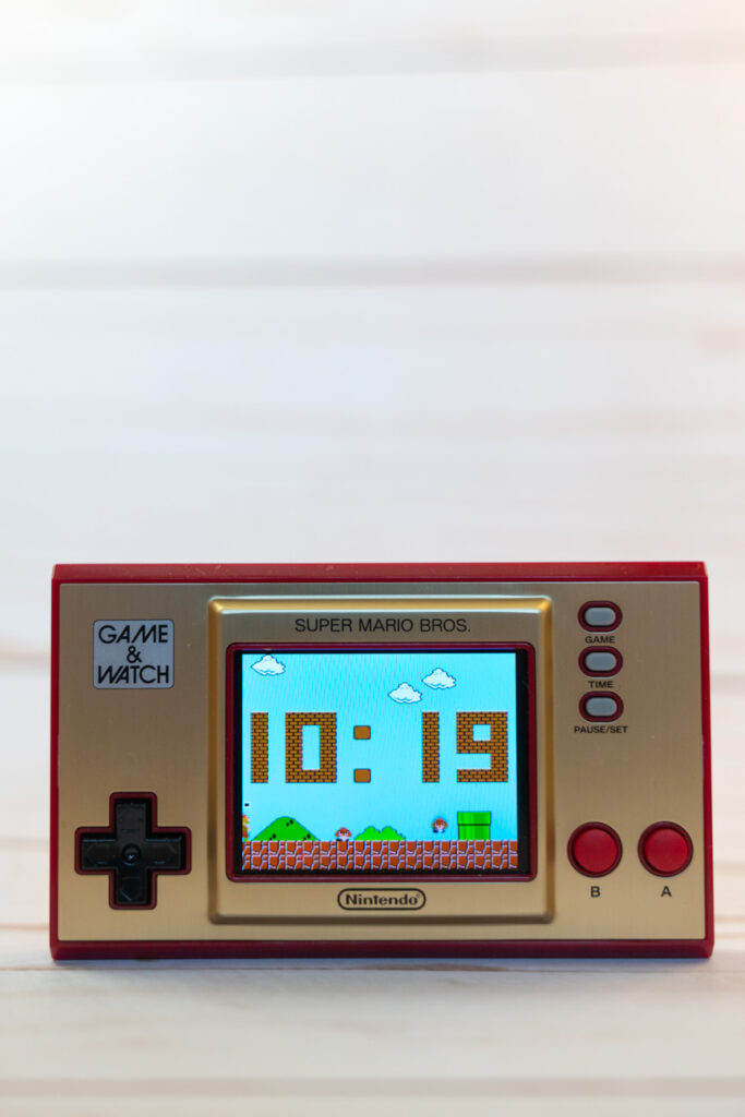 image of nintendo game and watch in front of white background