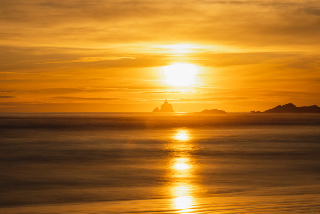 long exposure image of lighthouse in the sunset indian beach oregon