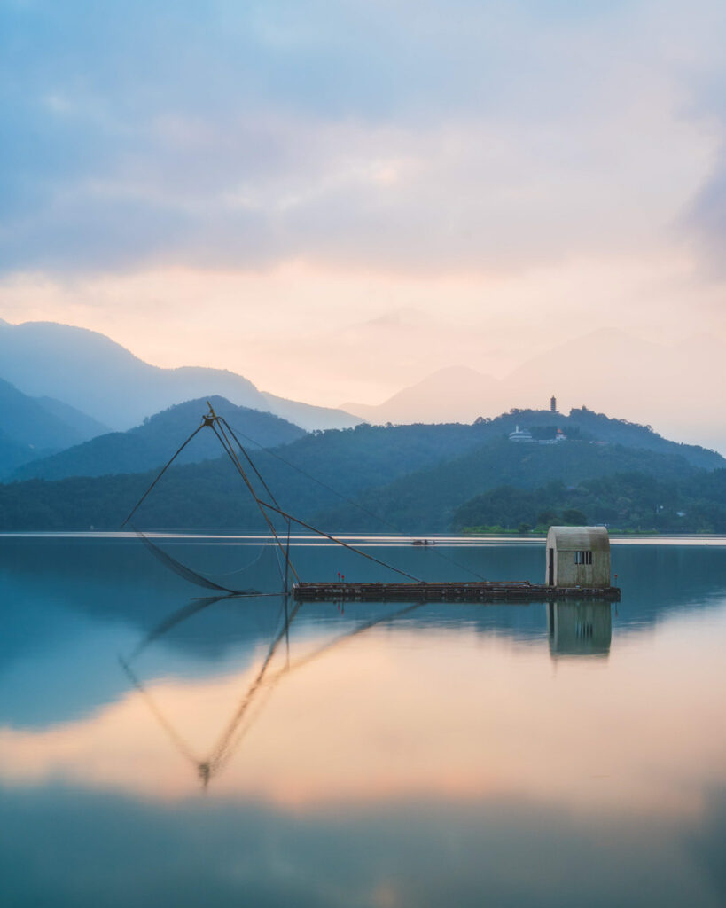 image of an old fishing boat in lake using long exposure