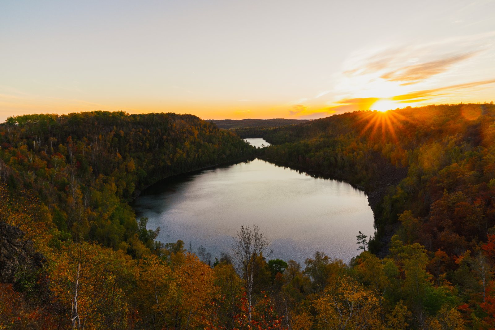 Bean Lake surrounded by autumn forest at sunset, Minnesota